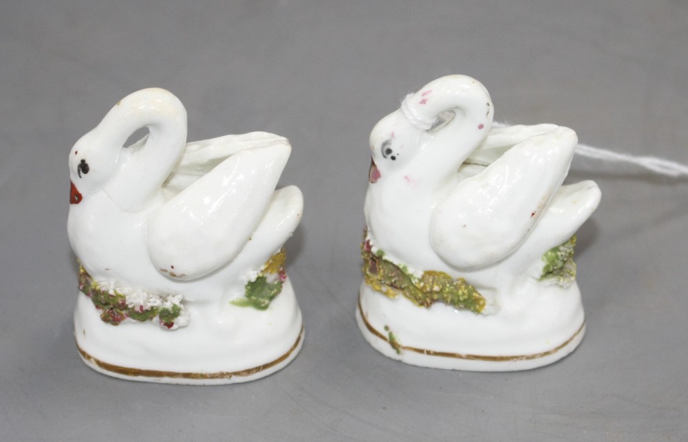 A pair of Staffordshire porcelain models of swans, c.1830-50, H. 4.9cm